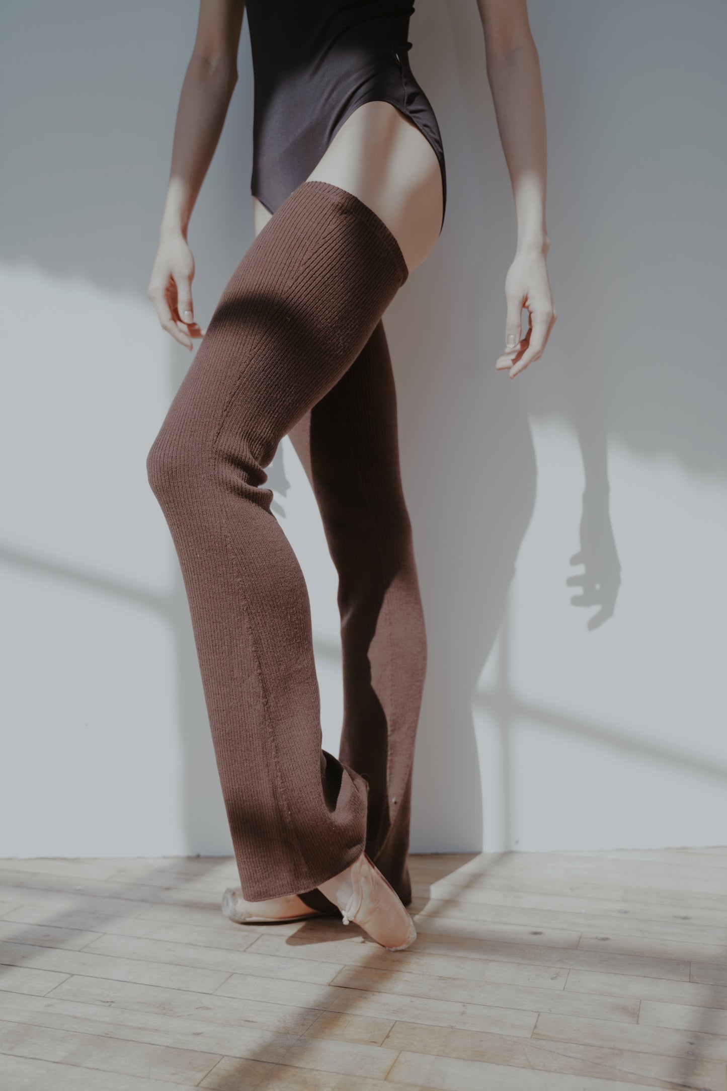 ballet dancer wearing long, full length wool legwarmers