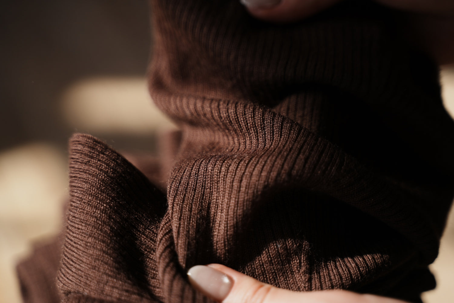 close up of brown legwarmers showing wool knit texture