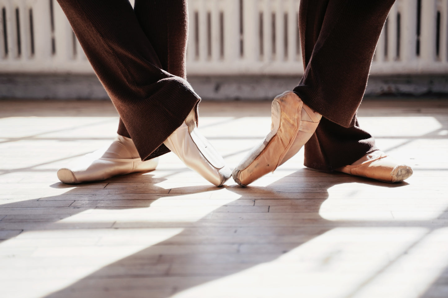 two dancers wearing wool ballet legwarmers 